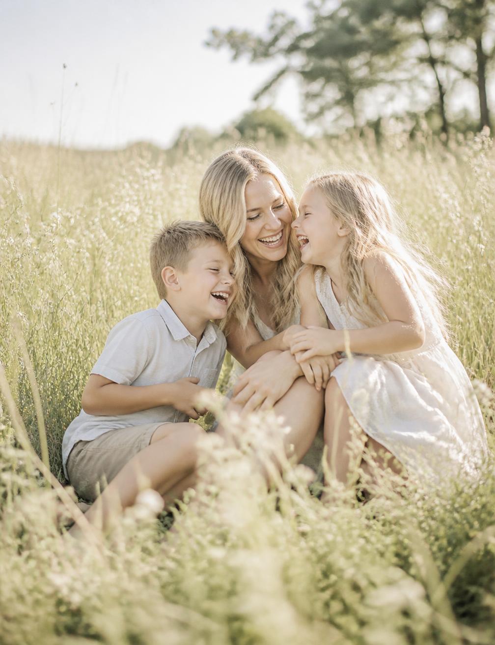 Family photography session in a sunlit field near Mooresville NC